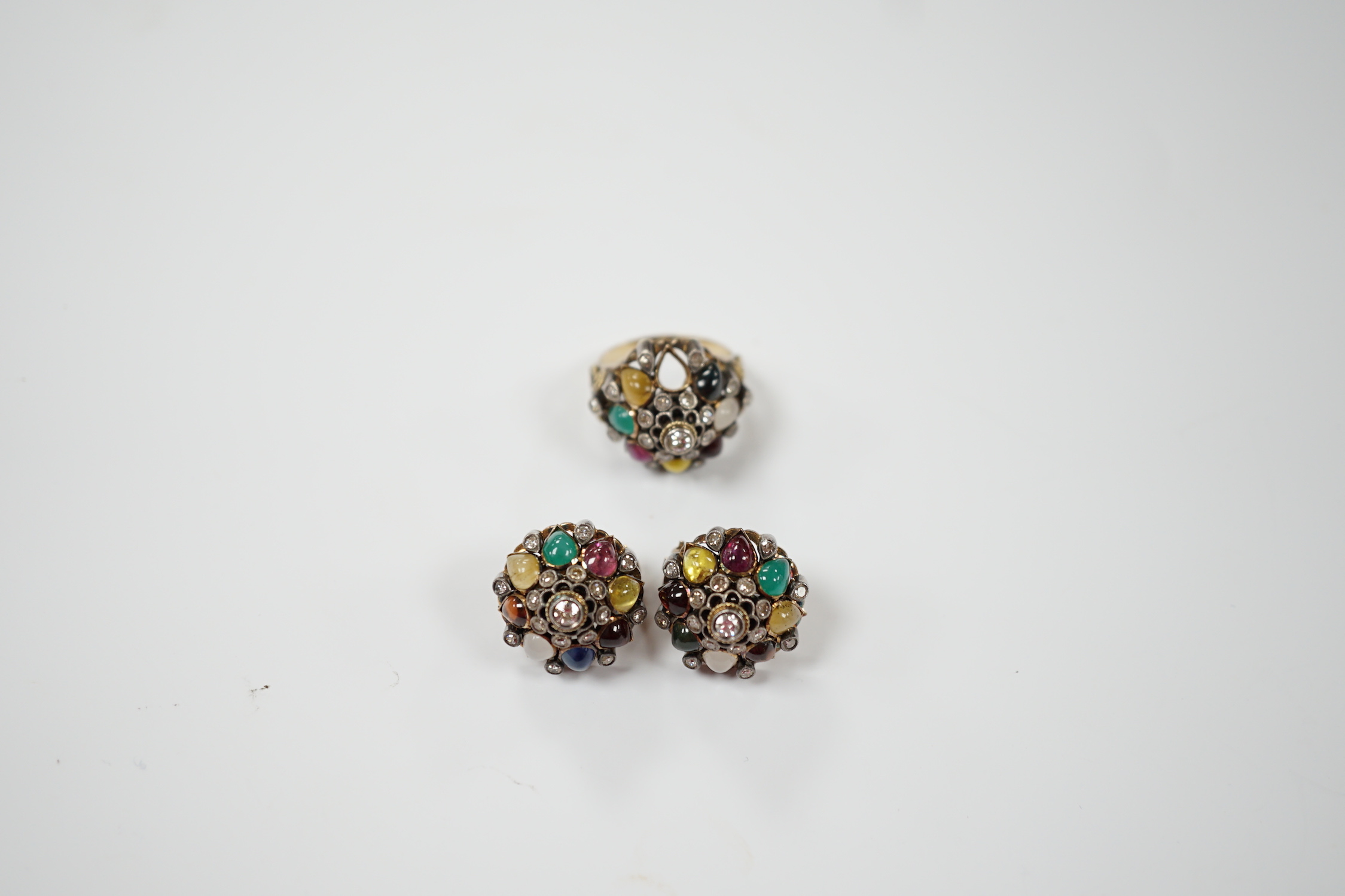 A continental yellow metal, diamond and multi cabochon gem set suite of jewellery, comprising a domed ring, size K(stone missing) and pair of ear clips, 17mm, gross weight 18.7 grams.